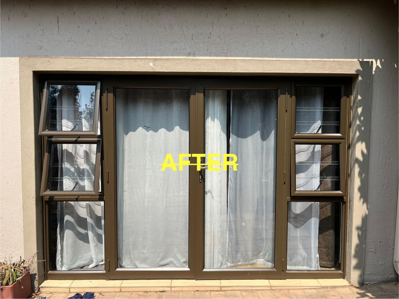 Storefront after aluminium polishing, with renewed brown-framed glass doors and windows