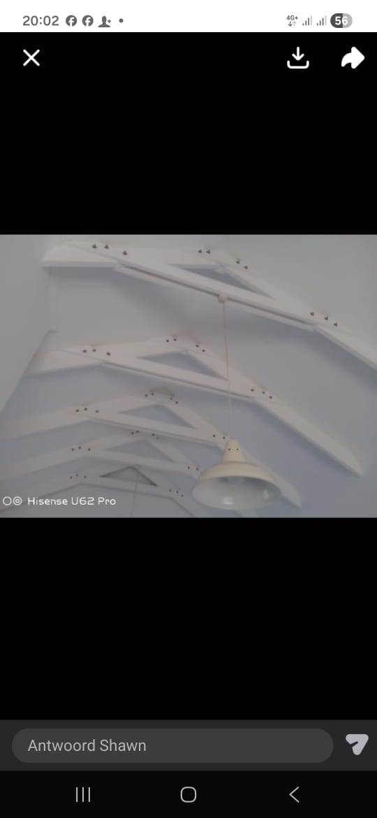 Ceiling installation with curved panels and recessed lighting