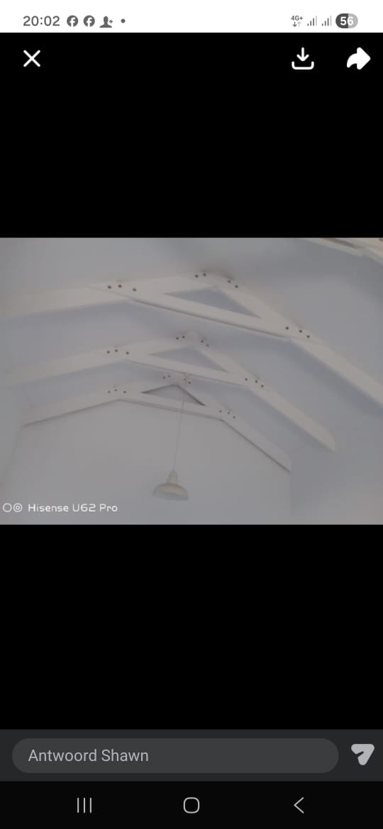 Ceiling with exposed beam details and recessed lighting