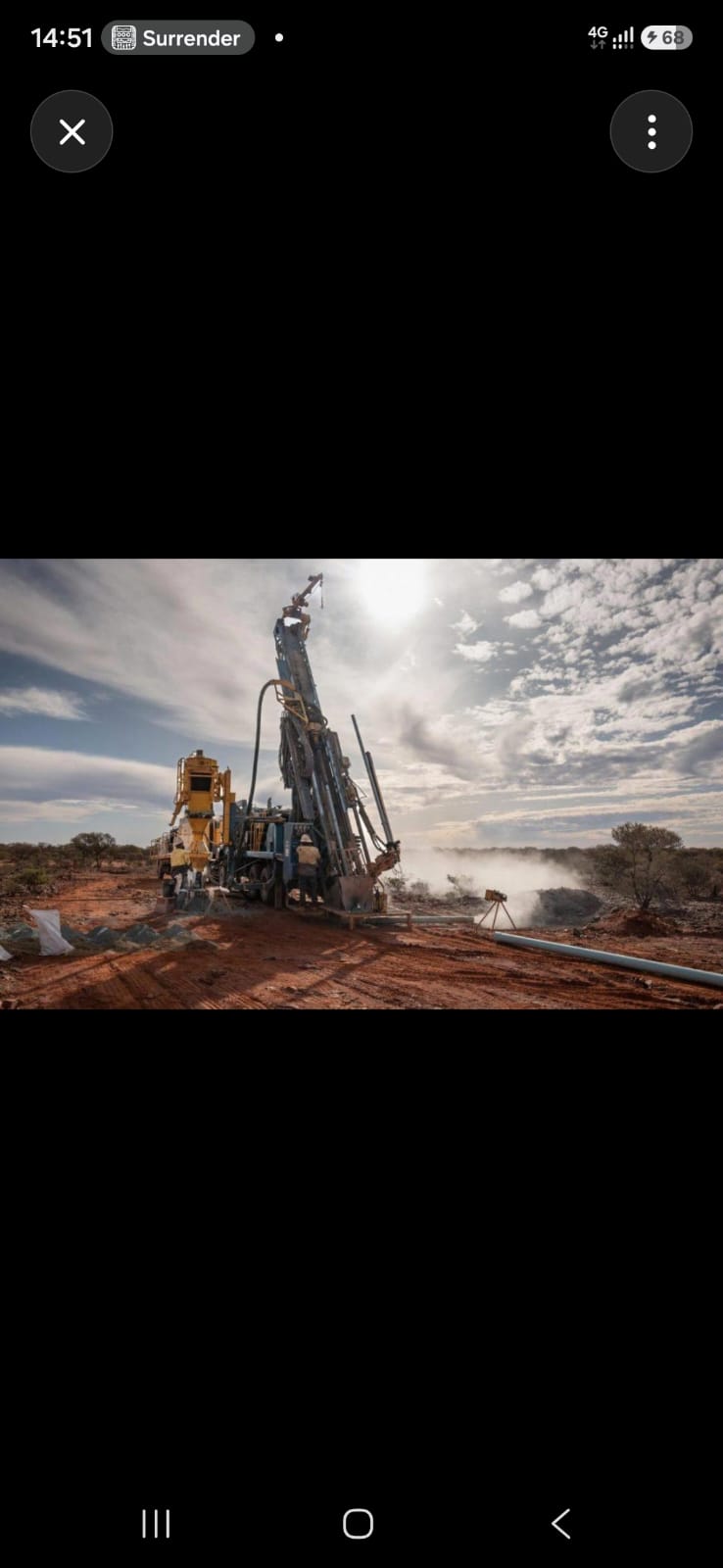 Industrial drilling rig operating in an arid landscape