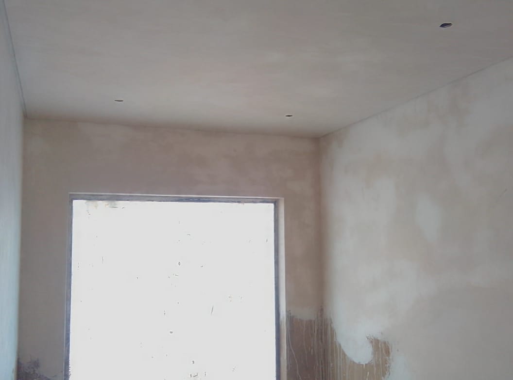 Interior room with drywall and ceiling under construction