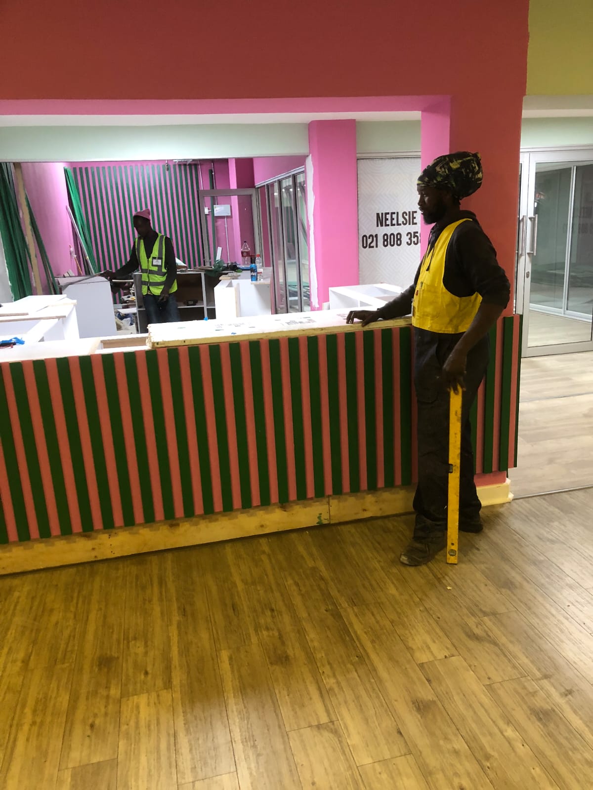 Worker at reception desk during office construction