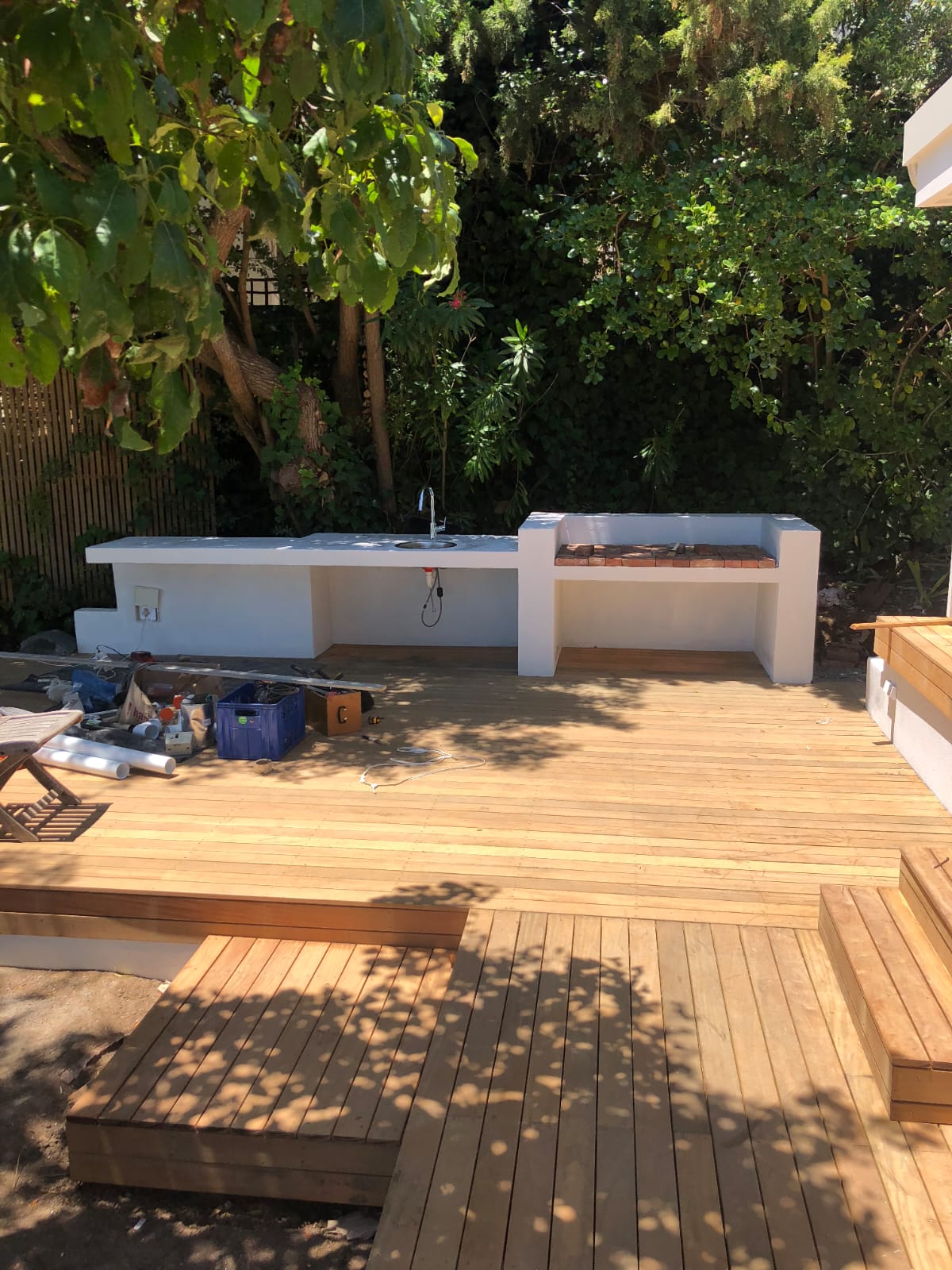 Outdoor kitchen under construction on deck