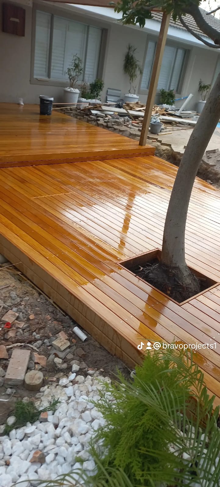 Deck with tree growing through it, showcasing outdoor woodwork