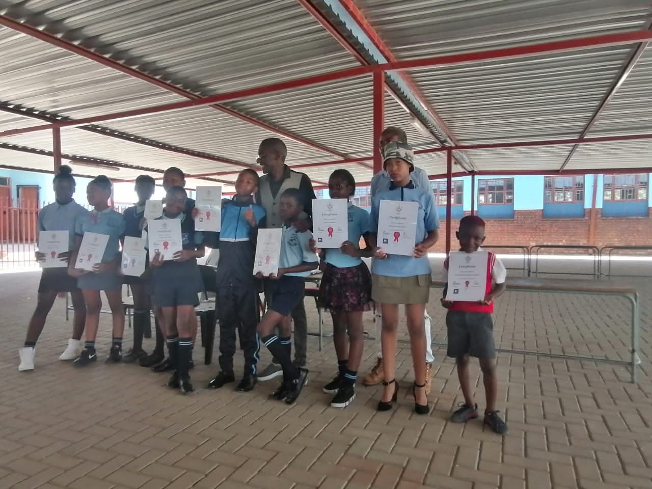 Group holding certificates at award ceremony