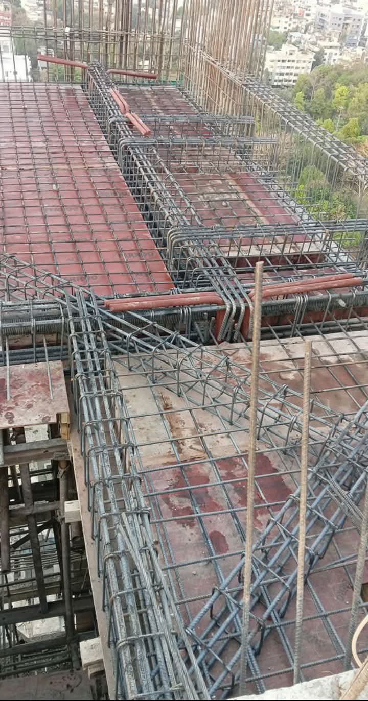 Overhead view of building under construction with rebar grid