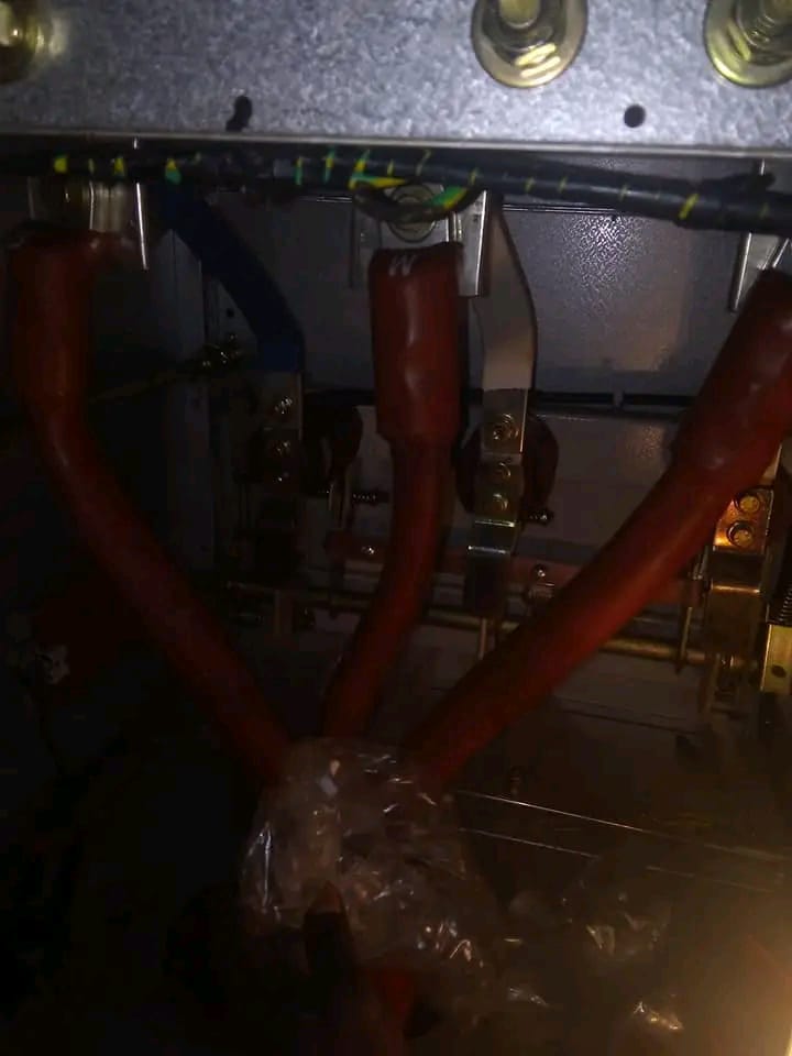 Electrical panel with red pipes and brass fittings mounted during installation