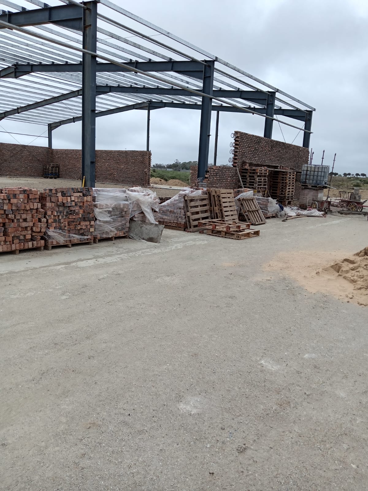 Steel-framed construction site with building materials
