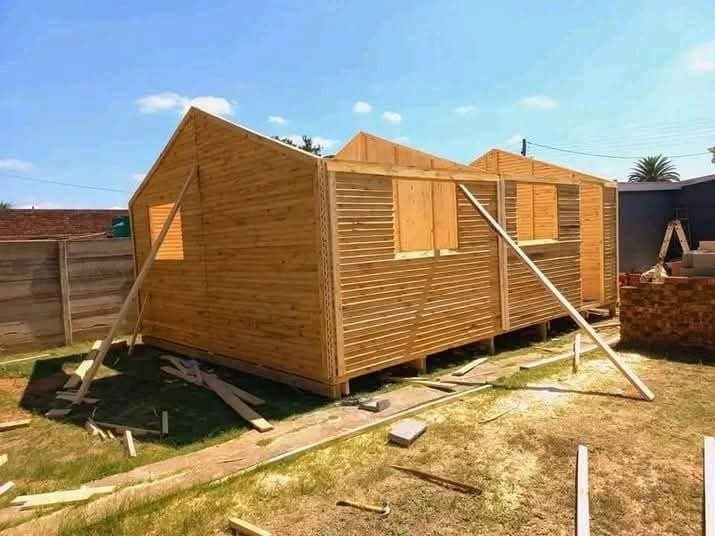 Newly constructed wooden garden shed in residential backyard