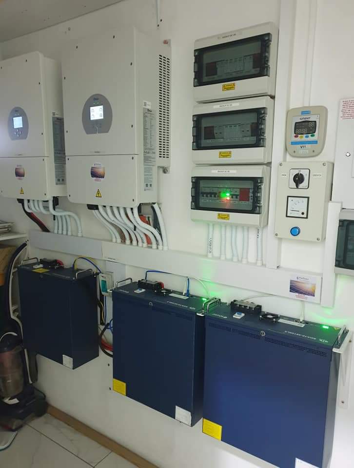 Solar power system installation with wall-mounted inverters and battery storage units