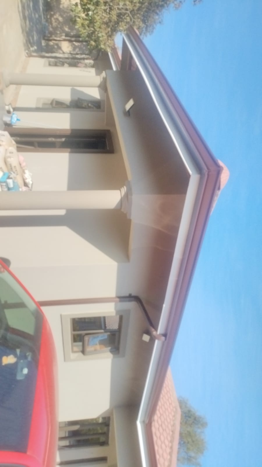 Two story cream and burgundy residential building