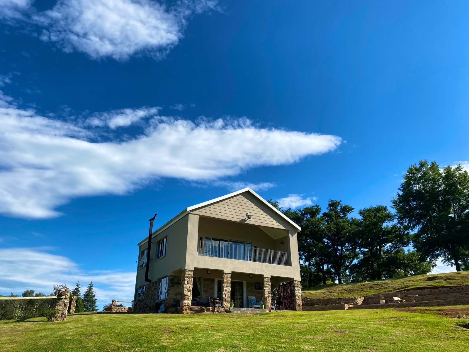 Modern two-story house exterior on green lawn