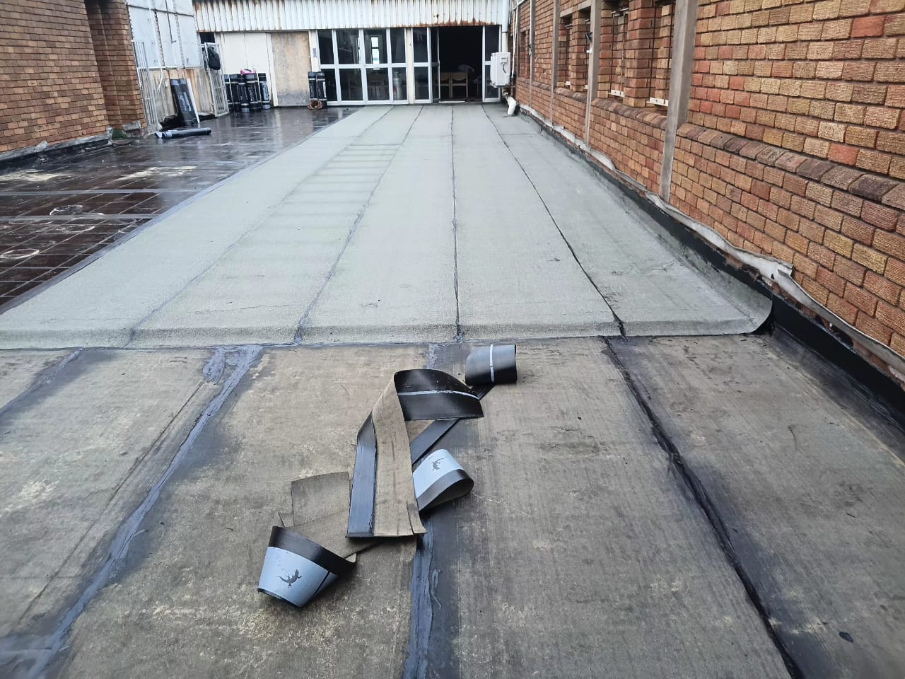 Damaged roof membrane before waterproofing