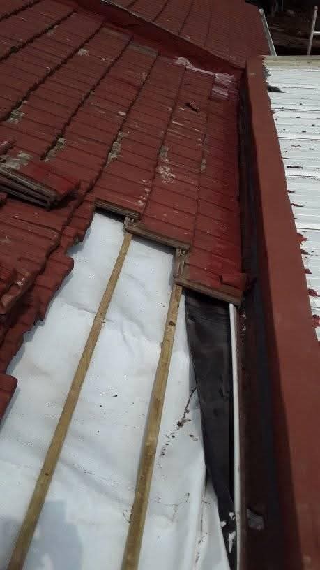 Roof repair with white underlayment and framing
