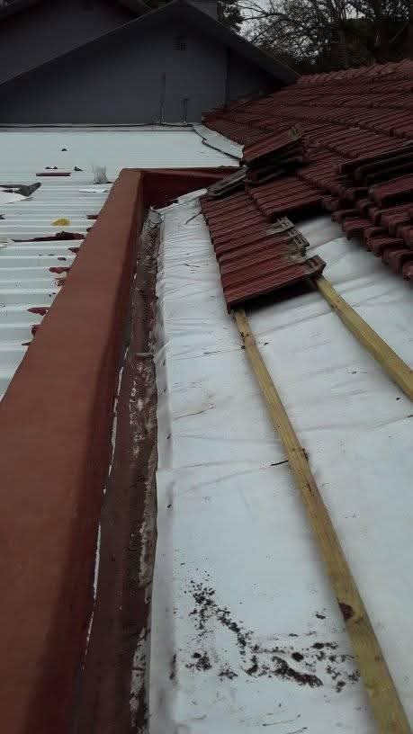 Roof under construction with tiles and underlayment
