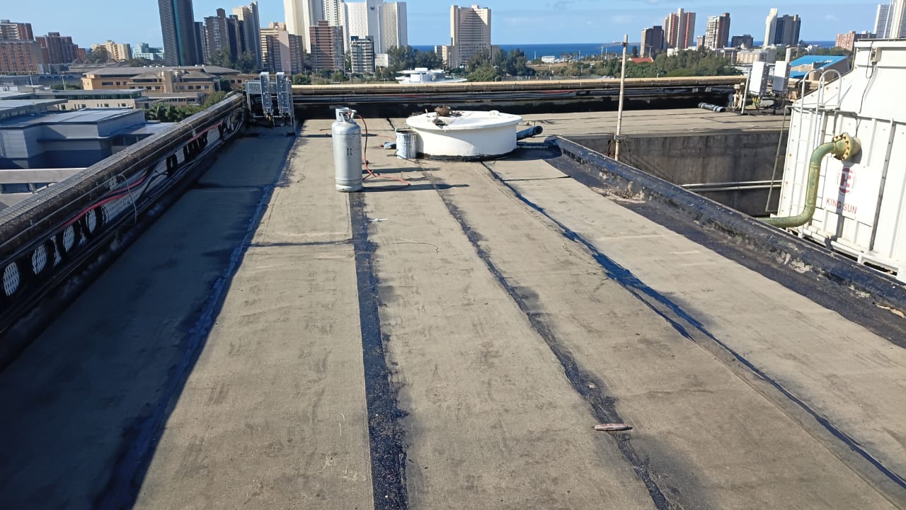 Commercial waterproofing rooftop with city view